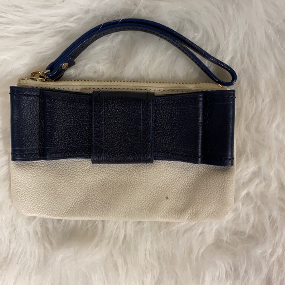 Navy and white leather Kate Spade wristlet with bow